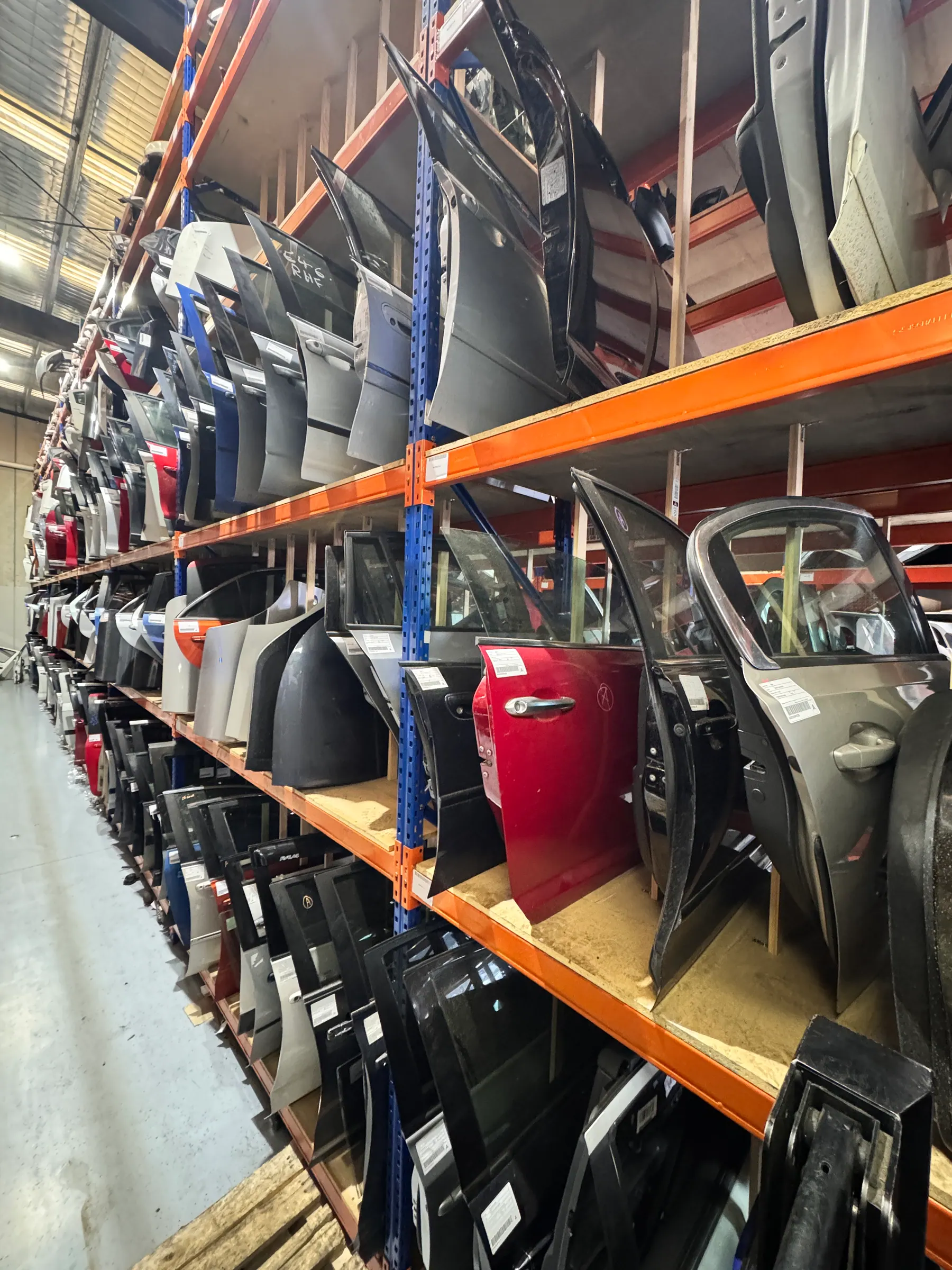 Warehouse aisle with doors, panels and guards ready for dispatch.